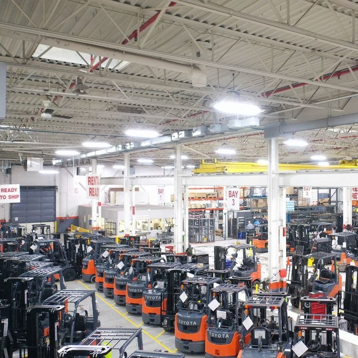 Technician repairing a forklift in the workshop