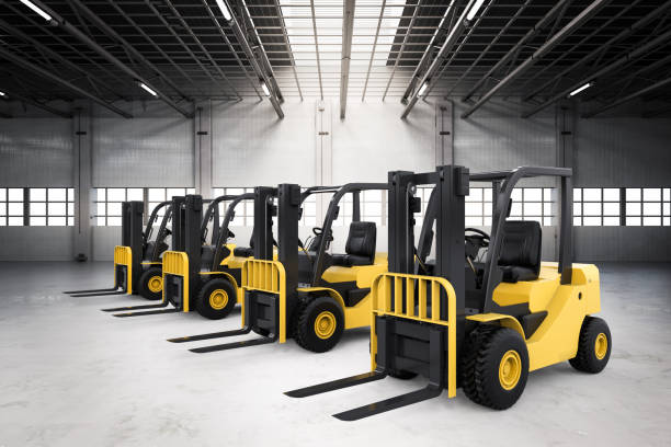Forklift lifting pallets inside a warehouse